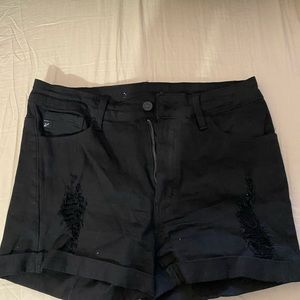 Black distressed Kan Can shorts. Really cute.